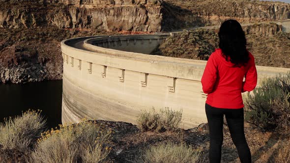 Asian woman hiking near the Salmon Falls Dam in Southern Idaho