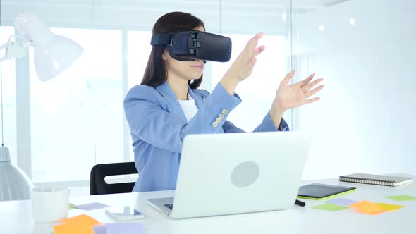 Girl Wearing virtual reality glasses at Work, VR goggles