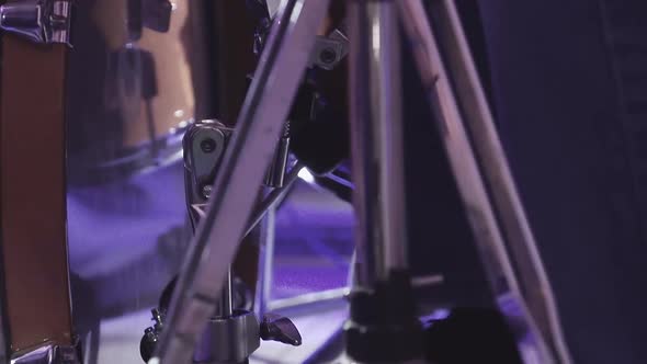 Drummer Plays Percussion Instruments at a Concert As Part of a Musical Group