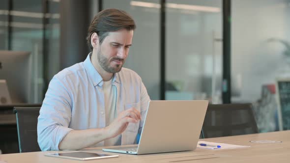 Mature Adult Man with Laptop Having Wrist Pain