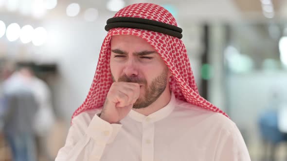 Portrait of Sick Young Arab Businessman Coughing