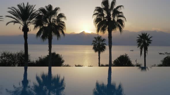 Resort Scene at Sunset. Pool Overlooking the Sea