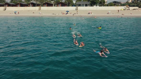 Child Learning to Swim in the Open Sea of Tropical Resort