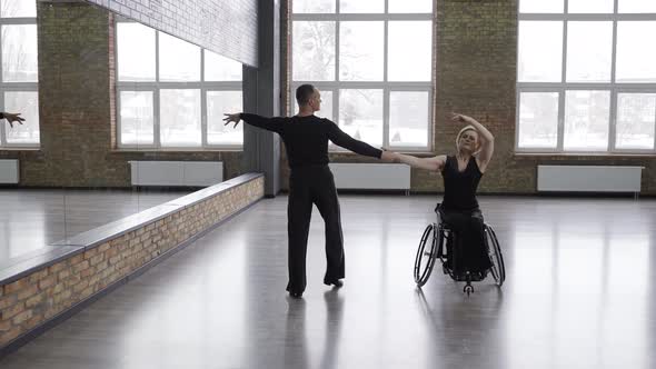 Exciting Dancing Couple Training in Dance Hall