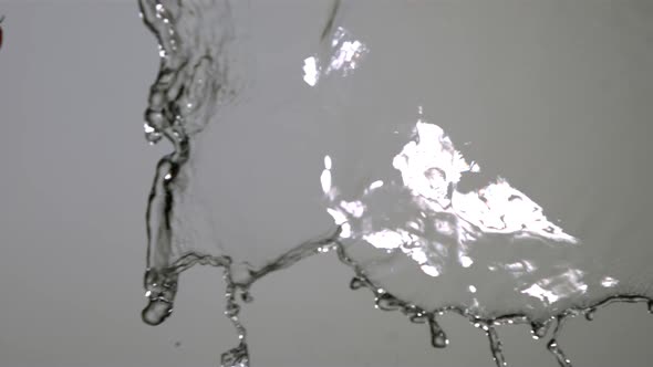Water splash with fruit in ultra slow motion 1500fps - reflective surface - WATER SPLASH w FRUIT 012