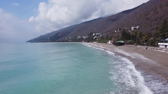 Mountains and sea. Lovely landscape. Blue sea water. Palm trees and sea.