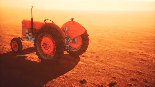 Vintage Retro Tractor on a Farm in Desert