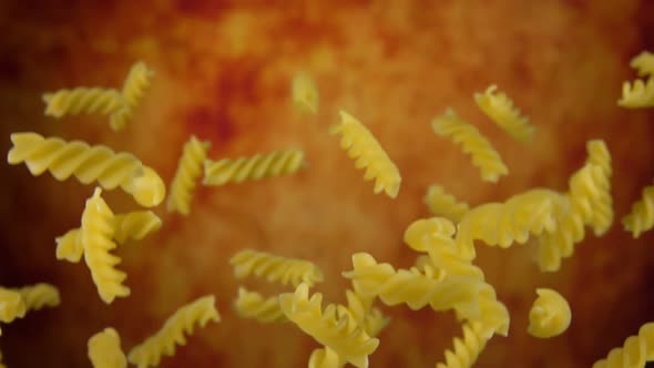 Dry Pasta Fusili Bouncing Up on a Yellow Ochre Background