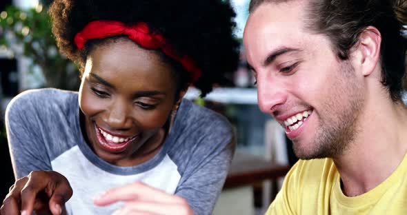 Man and woman interacting over digital tablet