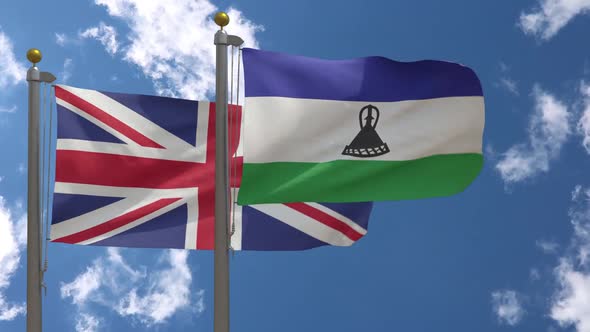 United Kingdom Flag Vs Lesotho Flag On Flagpole