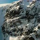 Flying close to Snowy Rocky Peak - VideoHive Item for Sale