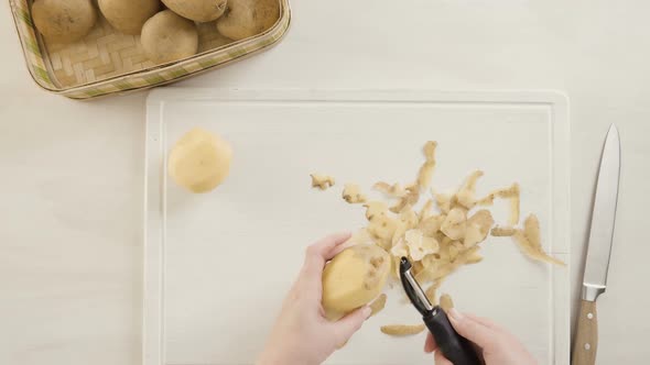 Time lapse. Step by step. Peeling Yukon gold potatoes for classic mashed potatoes.