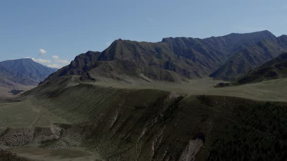 Green mountains of Altai under clear blue sky