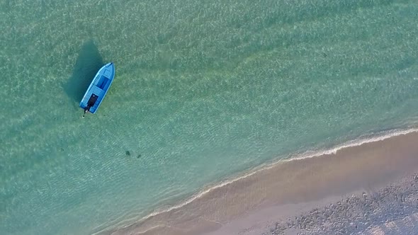 Summer seascape of tourist beach break by blue ocean with sand background near waves