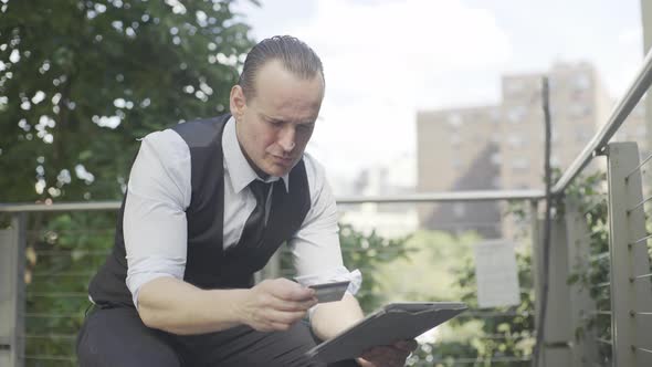 Businessman shopping online using digital tablet