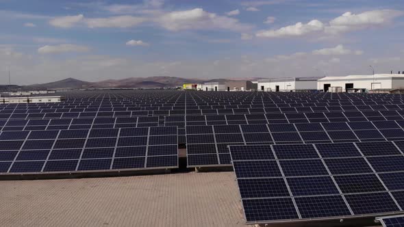 Aerial Shot of a Huge Solar Power Plant in a Big Field. Electricity Generation From Solar Energy