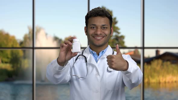 Doctor Showing Pills and Giving Approval Sign.