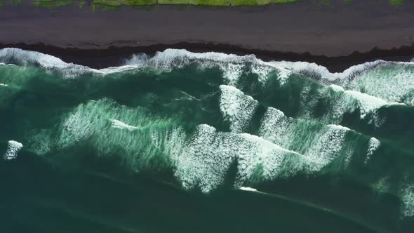 Aerial Top View of Beach with Black Sand