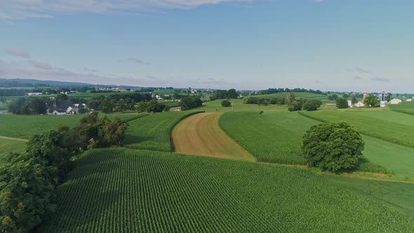 Aerial View On Pennsylvania Countryside With a Single Rail Road Track and a Small Bridge