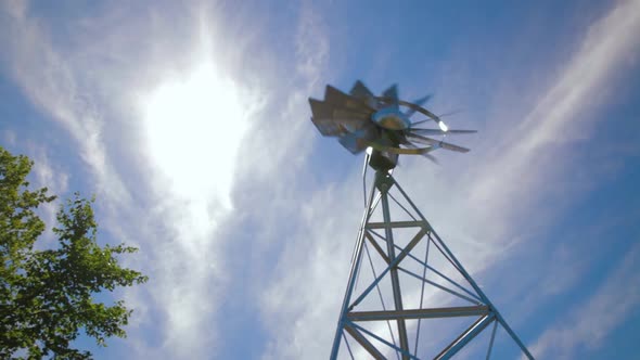 Metal Windmill During Fast Breeze