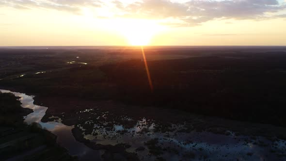 Beautiful Sunset Above the Wild Swamp and Forest