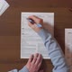Man Filling In Individual Income Tax Return At Table - VideoHive Item for Sale