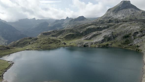 Aerial Drone View Over the Lake Ayous and the Surrounding Mountain Range in the Pyrenees in France