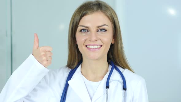 Portrait of Thumbs Up by Female Doctor in Clinic