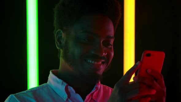 Portrait Young Stylish Male African American Smiling Texting His Smartphone