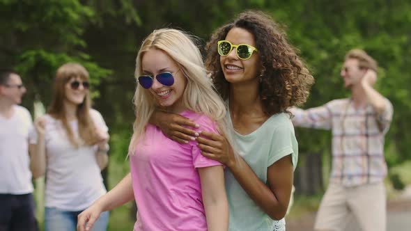 Two Multiracial Females Happily Dancing Outdoors, Young People Enjoying Party