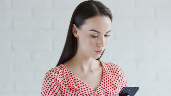 Cheerful Woman Using Smartphone