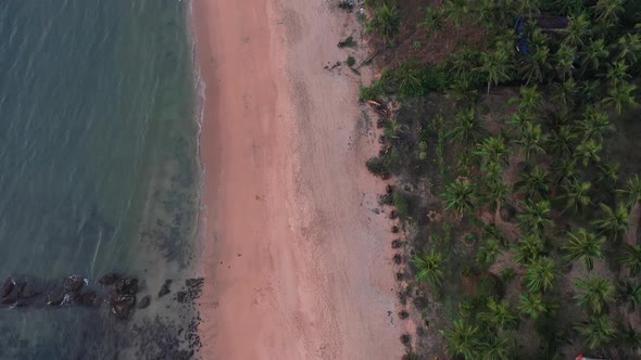 Fly Over Sandy Shore With Lush Forest Mountains At The Tropical Beach In South Goa India