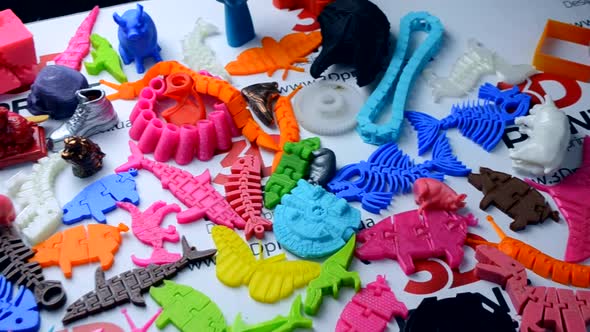 Many Bright Multicolored Objects Printed on a 3d Printer Lie on a Flat Surface