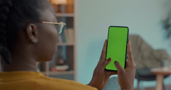 Woman Texting on Green Screen of Modern Smartphone