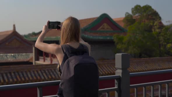 Slowmotion Steadicam Shot of a Young Woman Travel Bloger Visiting the Forbidden City - Ancient