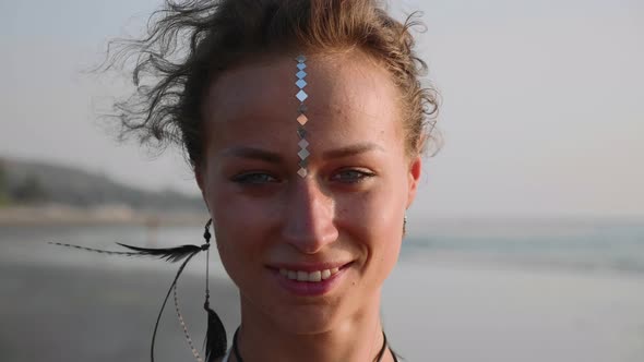 Portrait of Young Woman with Indian Bindi Looking To Camera 