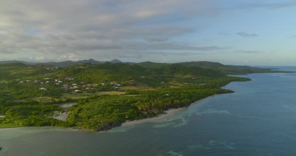 Aerial of beautiful green landscape along sea, Cap Chevalier, Sainte-Anne