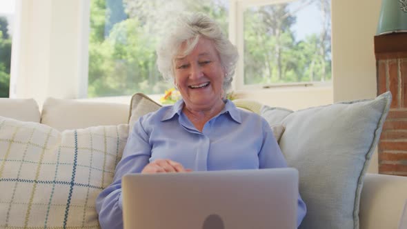 Senior caucasian woman using laptop computer for video chat