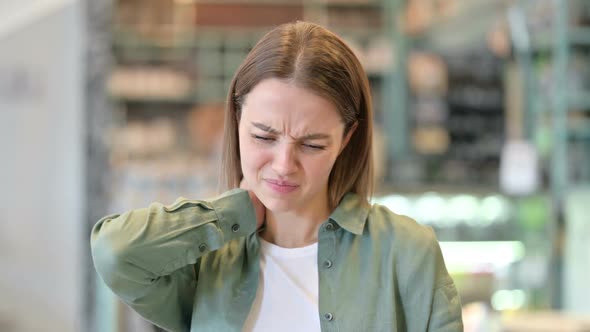 Portrait of Stressed Woman Having Neck Pain