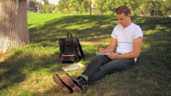 Guy Studying in Park