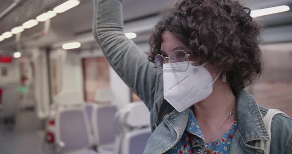 Young woman travelling on the train during lockdown