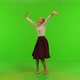 A stylish woman gets some amazing news on her phone, dances happily over a green screen 4K - VideoHive Item for Sale