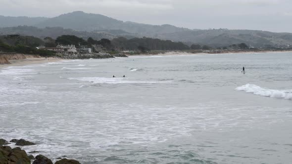 Panoramic view of people surfing the waves