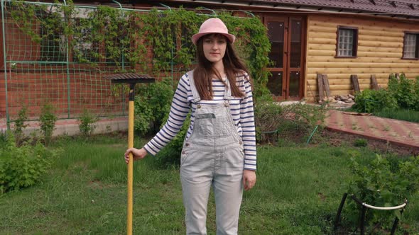 Portrait of Caucasian Young Beautiful Woman in Cap Smiling Cheerfully to Camera