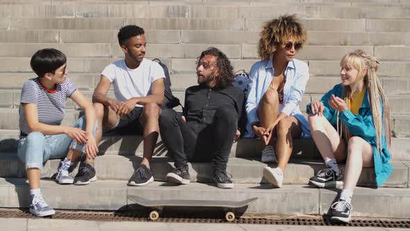 Stylish Young Friends Chatting on Street