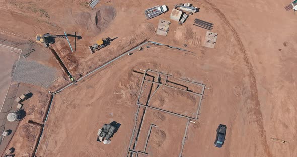 Construction Work in the Building a Laying Pipes in the Foundation for New Residential Complex