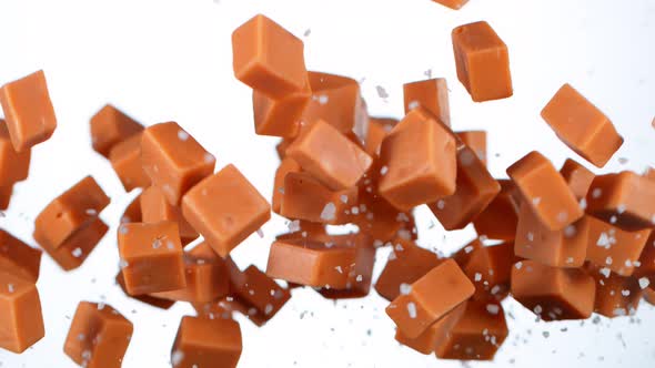 Super Slow Motion Shot of Salted Caramel Explosion Isolated on White Background at 1000Fps