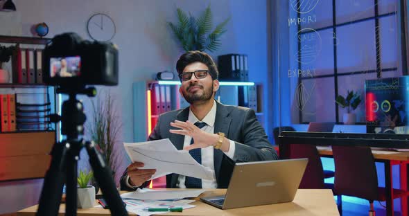 Businessman Recording Video for Business Channel and Throwing Up Over His Head a Lot of Papers