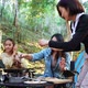 Young women cooking and use smartphone take photo on camping - VideoHive Item for Sale
