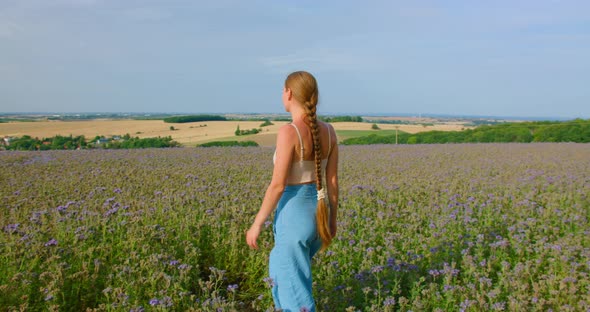 Free Woman Walks in a Field